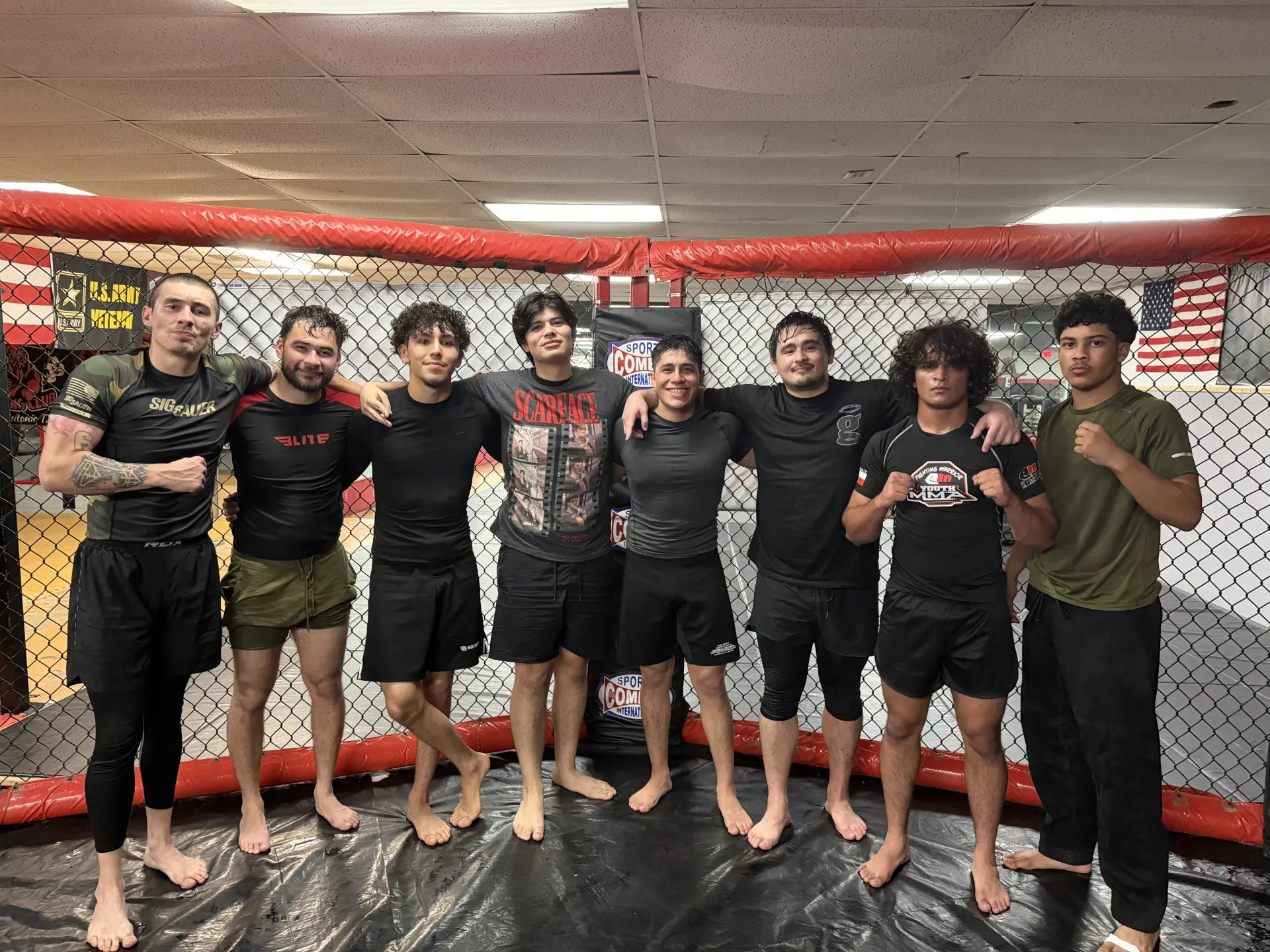 Guardians Grappling Academy team standing together inside the cage after training